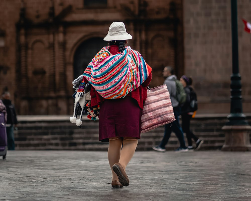 A person walking across a city square
